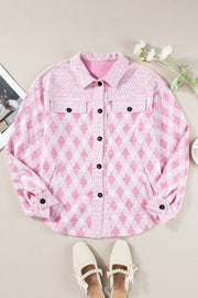 Pink diamond weave shacket with puff sleeves and buttoned front.