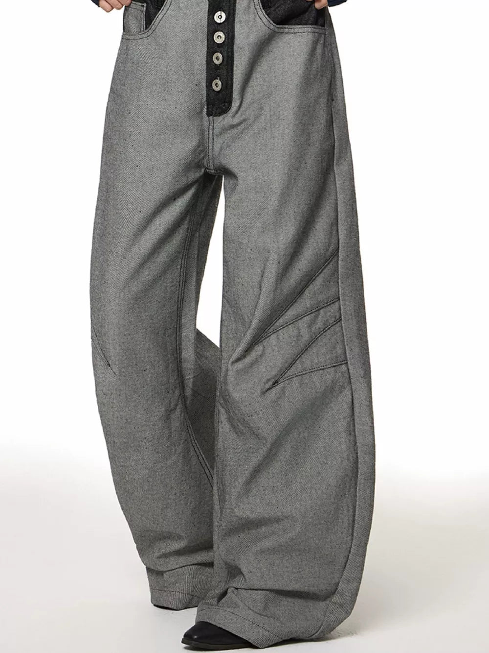 Men's grey cotton wide leg jeans with button fly and unique panel detailing.