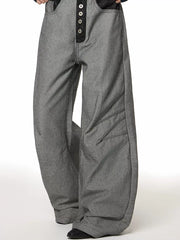 Men's grey cotton wide leg jeans with button fly and unique panel detailing.