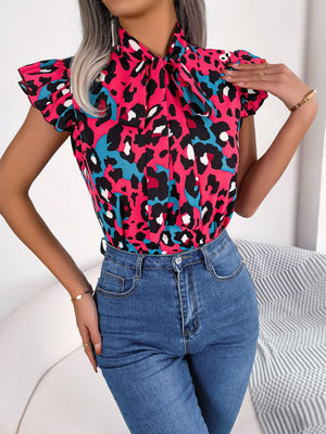 Hot pink leopard print blouse with ruffled sleeves and pussybow tie, short sleeves