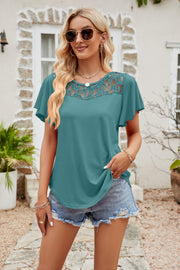 Turquoise lace yoke flutter sleeve tee with a round neckline.