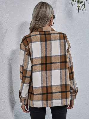 Checkered collared jacket in tan and white plaid with button cuffs.