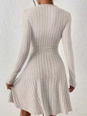 Light Gray ribbed wrap mini dress with long sleeves and A-line skirt.