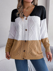 Colorblock cable knit cardigan with button front in camel, white, and black acrylic.