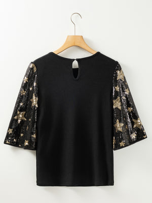 Black knit top with star sequin bell sleeves and keyhole back.