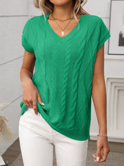 Green cable knit V-neck vest with short sleeves and textured cable detailing.