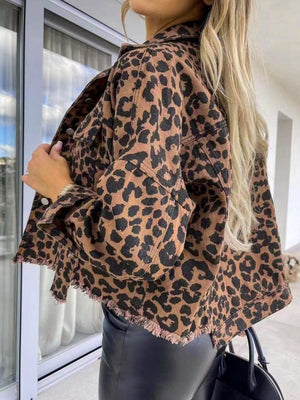 Leopard print denim shacket with raw hem detail and button front.