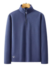 Men's blue fleece quarter zip sweatshirt with a diamond logo detail.