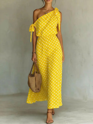 Yellow polka dot one-shoulder maxi dress with cinched waist and tie details