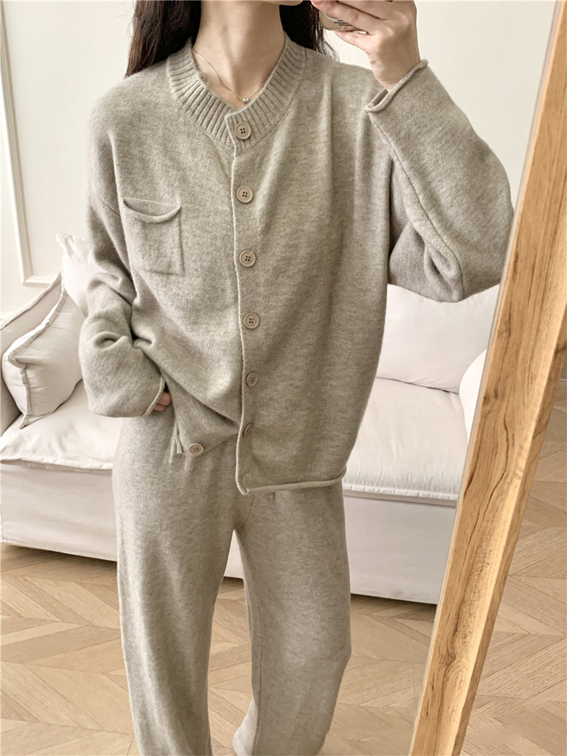 Ribbed knit cardigan and wide leg pants set in taupe acrylic with button front and chest pocket.