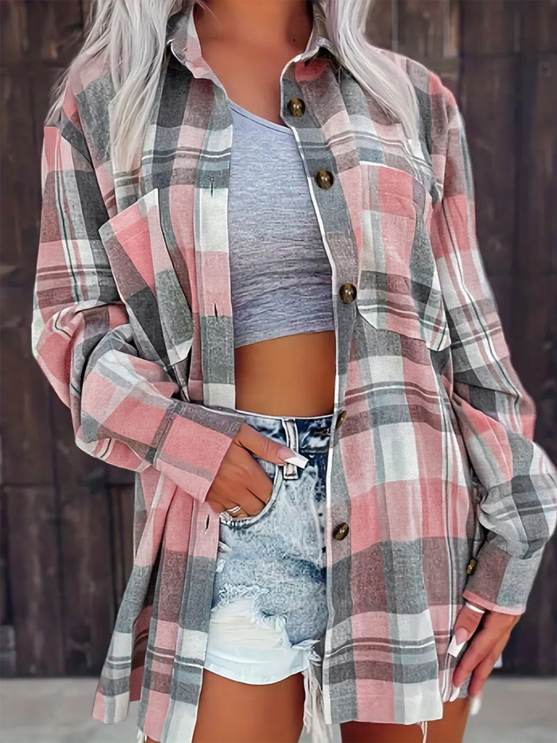 Oversized dusty pink plaid shirt jacket with button front and pockets.