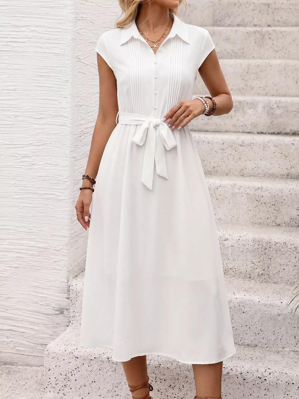 White cap sleeve midi dress with button front, pintuck detail, and tie waist