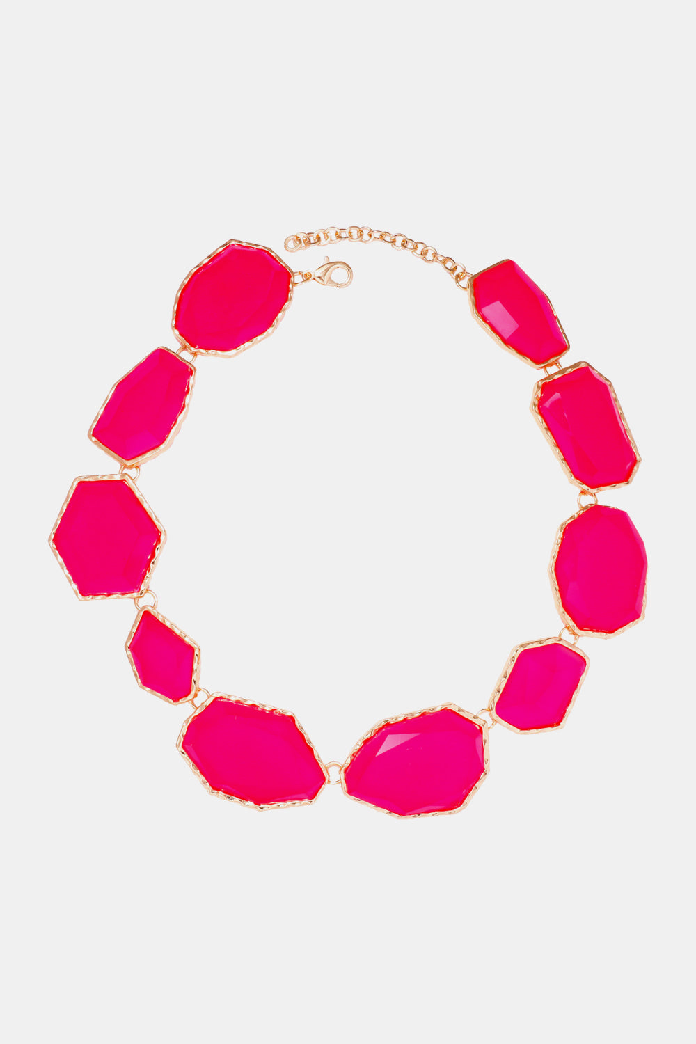 Hot pink resin stone collar necklace with gold-tone chain and irregular faceted stones.