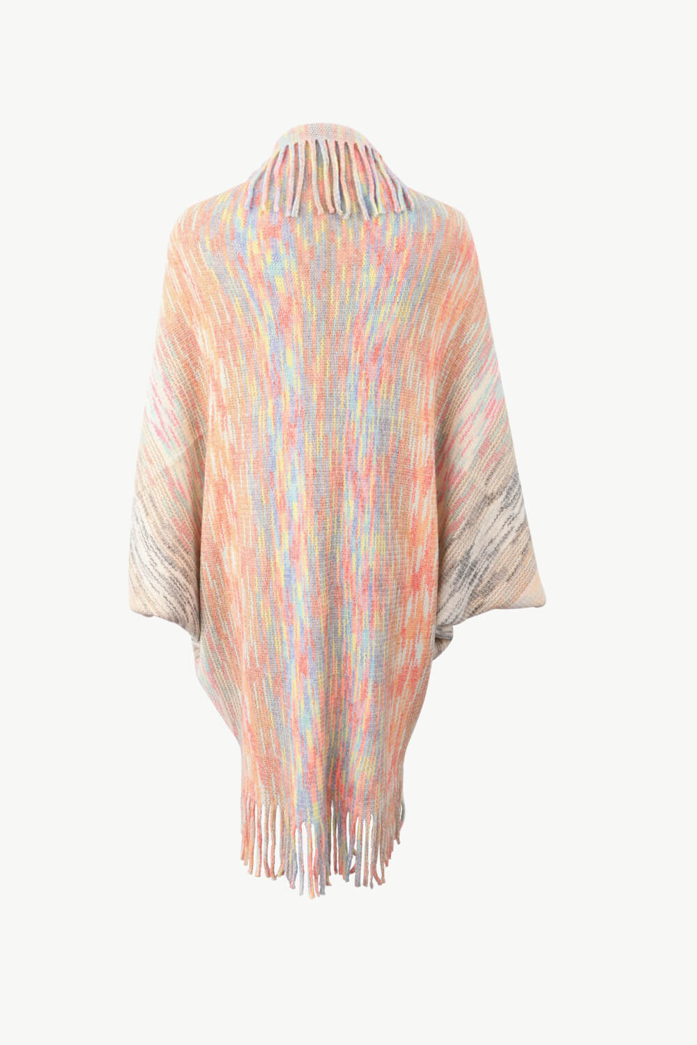 Textured stripe fringe cape with multicolor yarn and fringe detail.