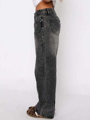 Wide-leg jeans in dark gray denim with contrast stitching and a buttoned fly.