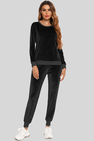 Black velvet lounge set with contrast trim neckline and cuffs.
