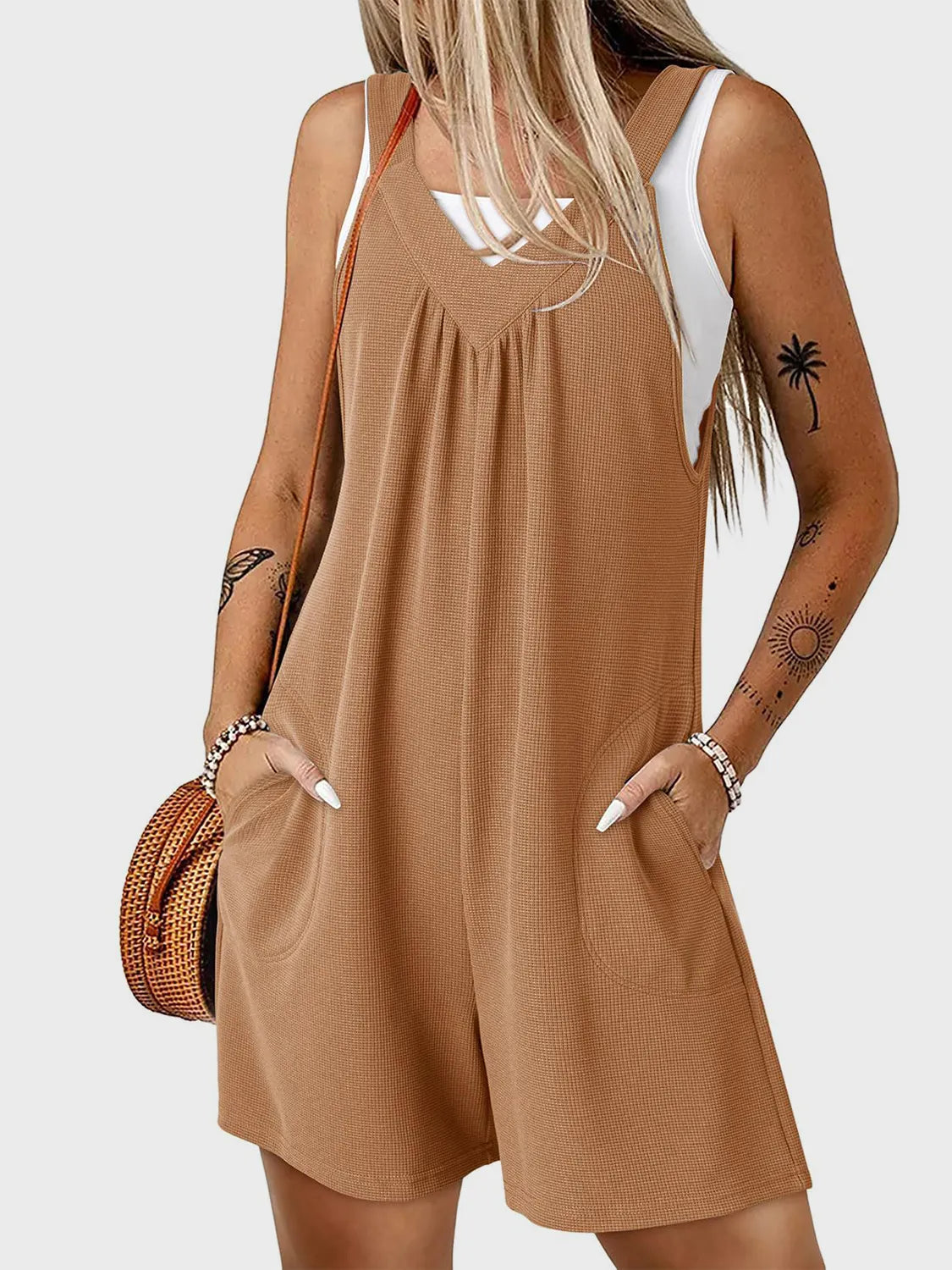 Coffee brown textured romper with gathered yoke and pockets, styled with a white tank.