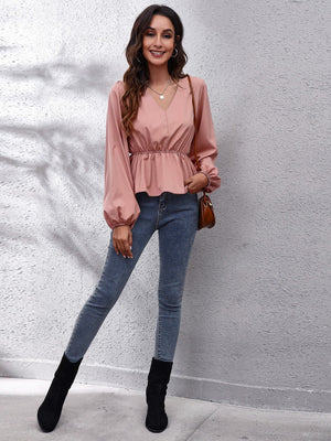 Dusty pink peplum blouse with V-neck and balloon sleeves