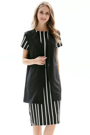 Black tailored sleeveless vest with single button closure over a striped dress.