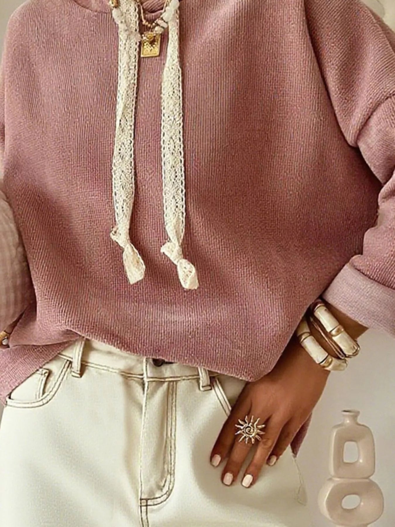 Dusty pink dropped shoulder hoodie with lace drawstrings and rolled cuffs.