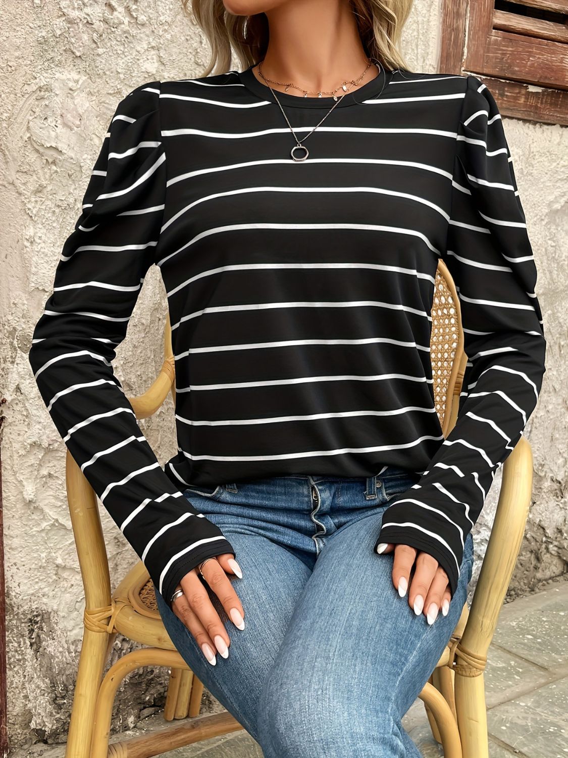 Black and white striped long sleeve top with gathered puff sleeves.
