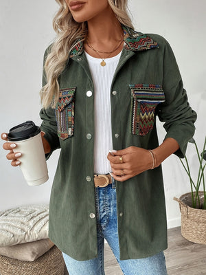 Army green corduroy overshirt with embroidered statement pockets and collar detail.