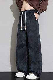 Black relaxed fit sweatpants with white drawstring and cloud pattern.
