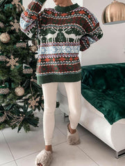 Fair Isle knit sweater with reindeer and snowflake motif in green, brown, and cream.