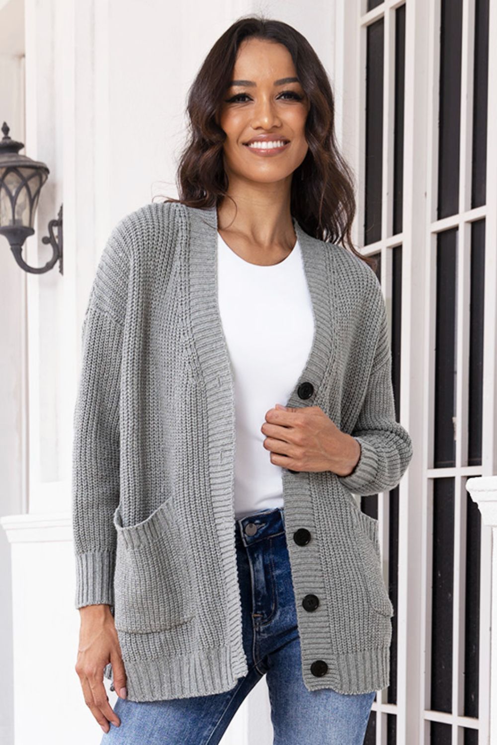 Dark gray oversized ribbed knit cardigan with pockets and buttons