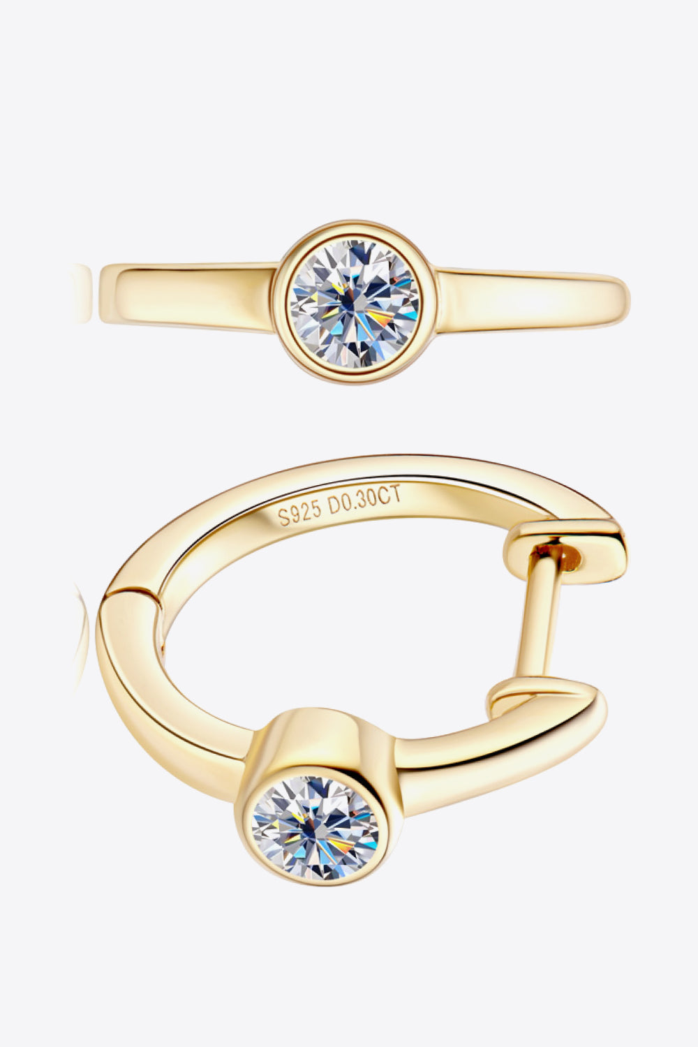 Gold bezel-set sparkle huggie hoop earrings with a single diamond accent.