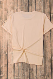 Tan crew neck t-shirt with cuffed sleeves and a knotted hem detail.