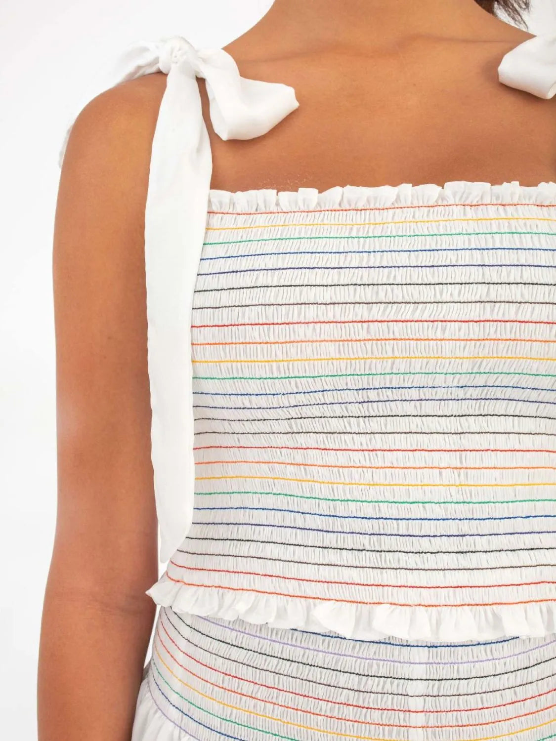 White smocked bodice set with rainbow stripes and tie straps.