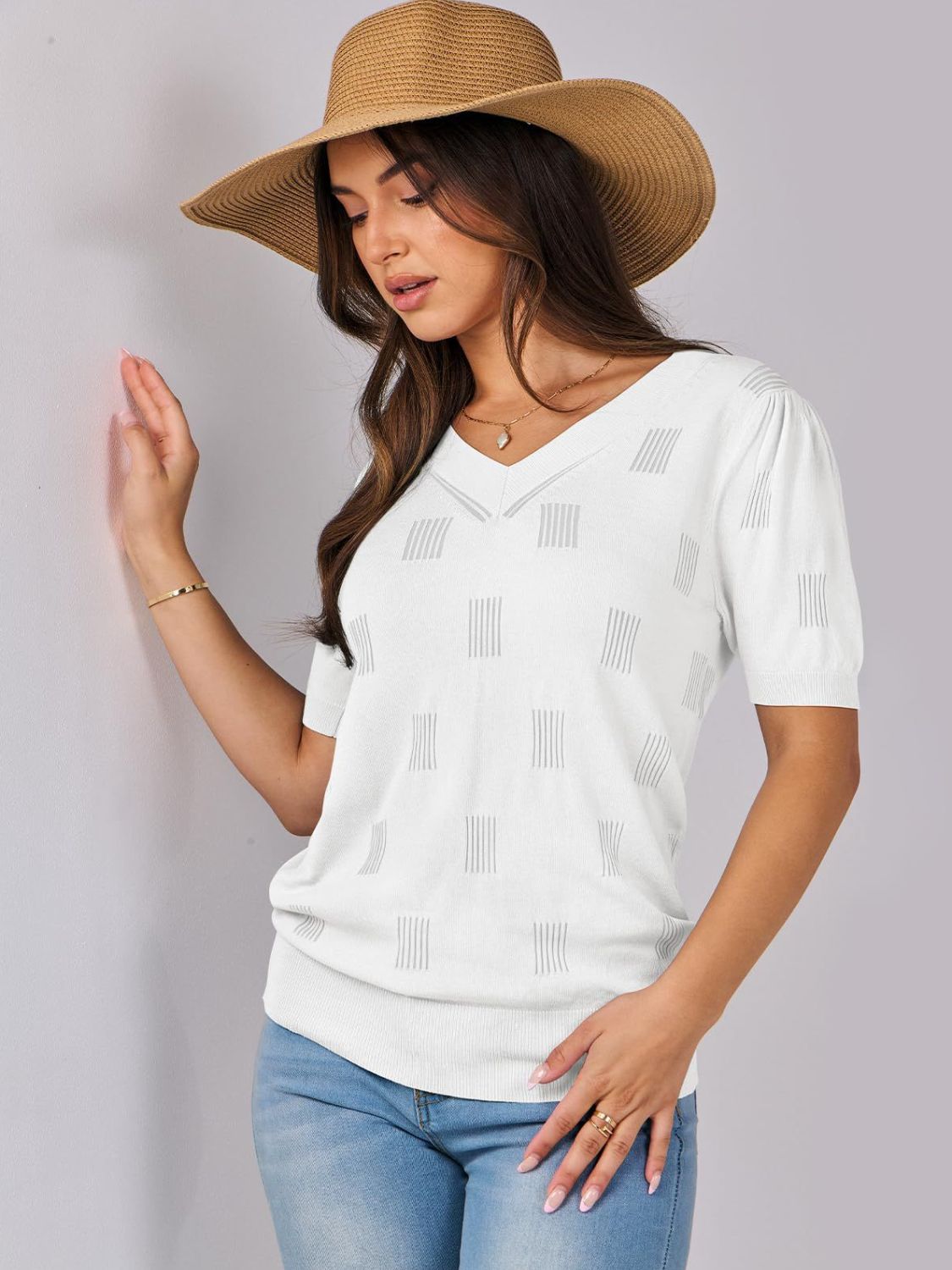 White textured stripe knit V-neck sweater with short puff sleeves.