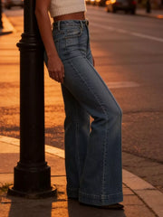 High-waisted flare jeans in light wash denim with button closure and wide leg.