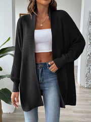 Black ribbed knit cocoon cardigan with open front and long sleeves.