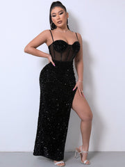 Black sequin corset maxi dress with sheer midriff and high slit.