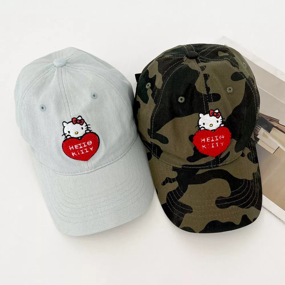 Hello Kitty embroidered cotton baseball caps in light and army green camouflage.