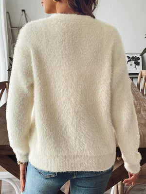 Cream plush button-down cardigan with pearl details, long sleeves, crew neck.