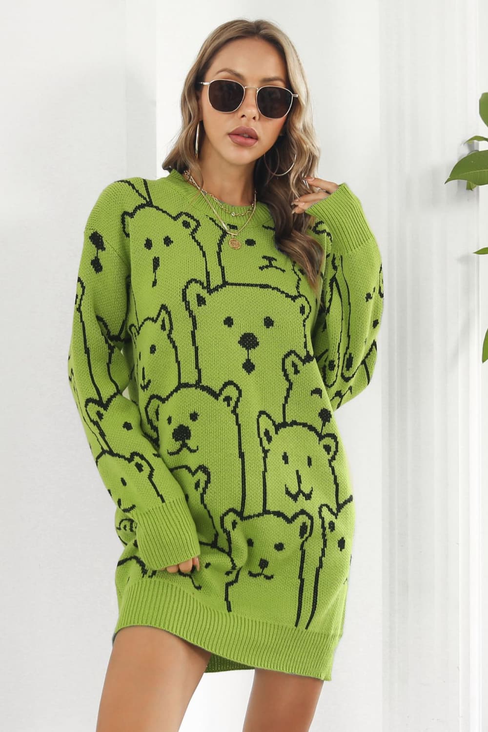 Yellow-green knit dress with allover black bear motif, crew neck, long sleeves.