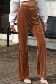 Velvet corduroy palazzo trousers in caramel with a wide leg and vertical ribbing.