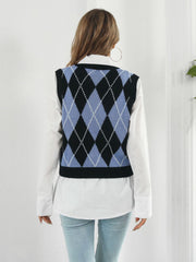 Black argyle knit vest with blue and white diamond pattern, acrylic material.