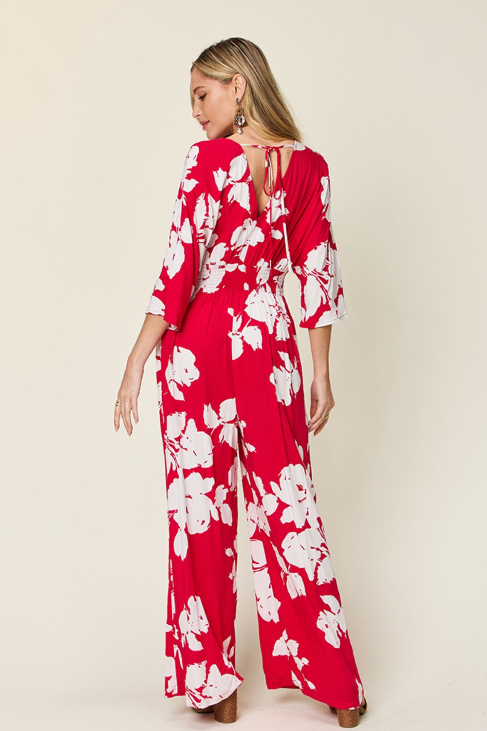Red floral kimono jumpsuit with tie back and wide legs
