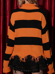 Orange and black striped knit sweater with distressed hem and bat motif.
