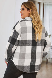Oversized black and white checkered shacket with button detail, long sleeves, and a relaxed fit.