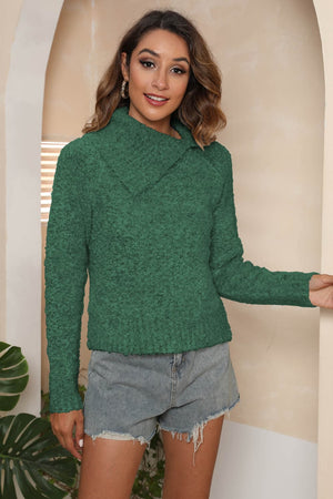 Dark green textured knit sweater with an asymmetric collar and long sleeves.