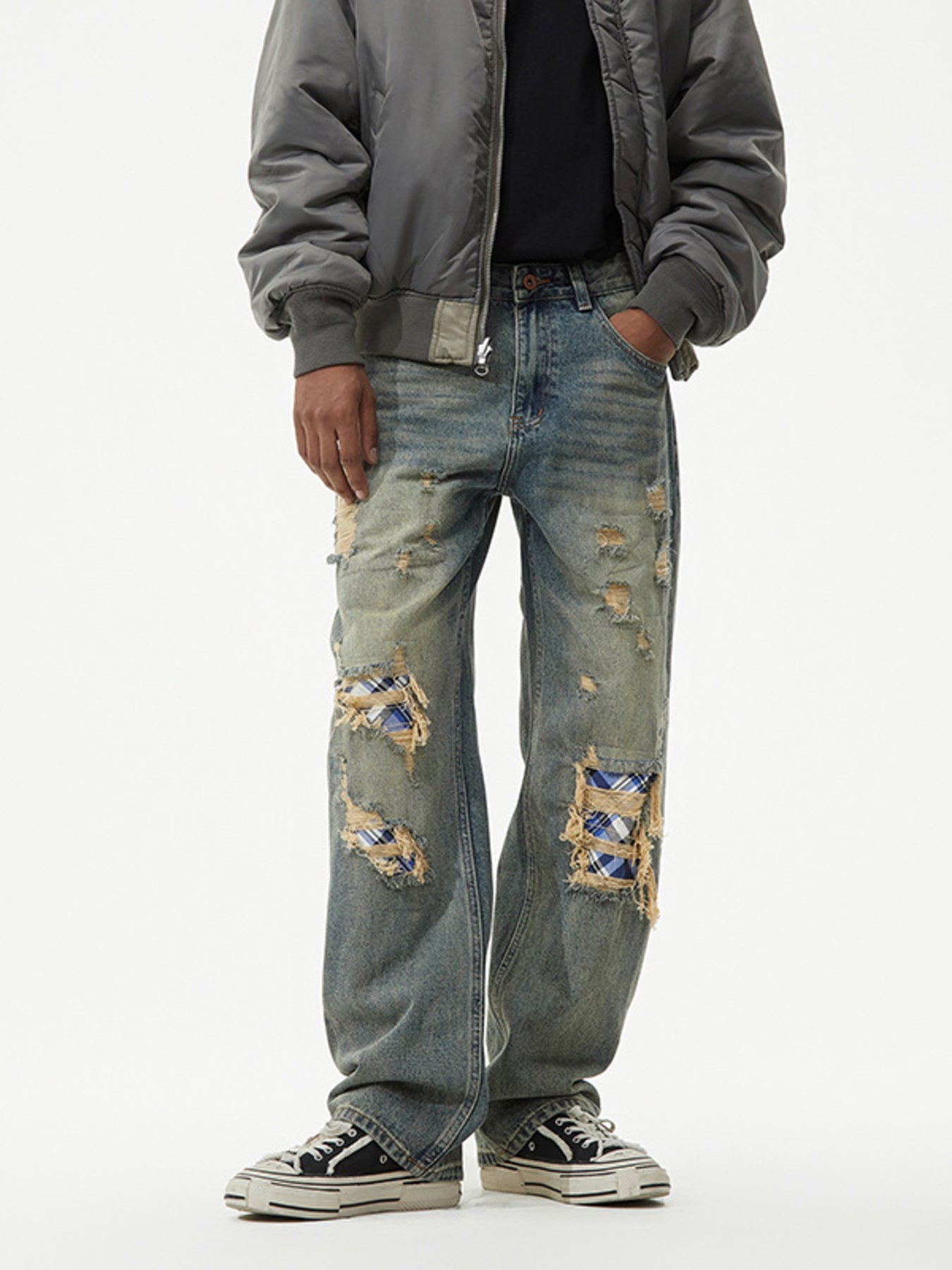 Distressed blue plaid patch wide leg jeans with ripped details.