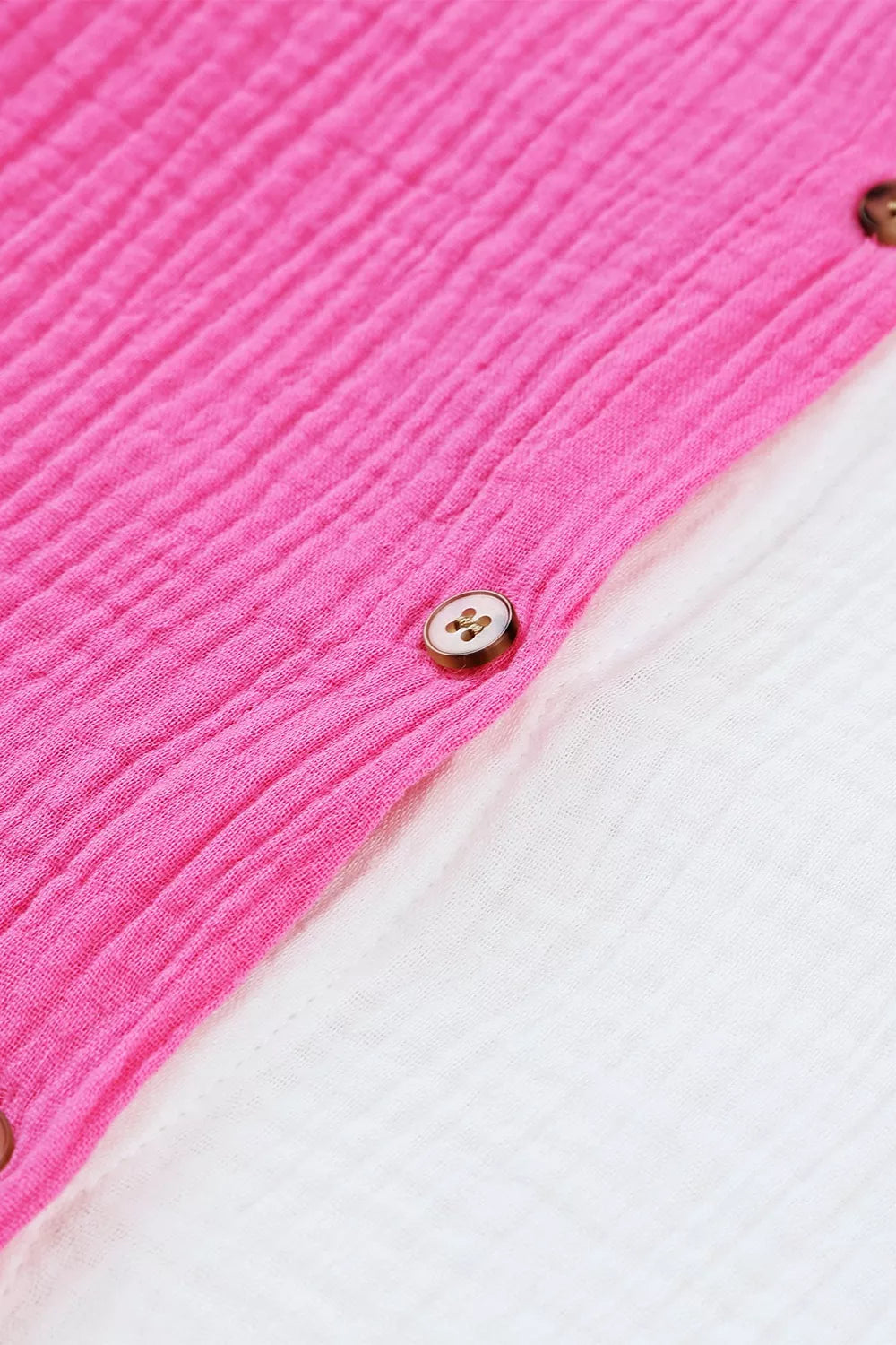 Chic color block cotton shirt with button detail and textured fabric.