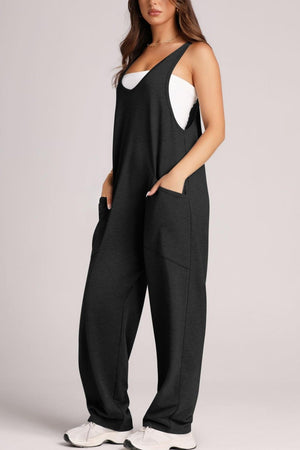 Black relaxed fit jumpsuit with oversized pockets, V-neck, sleeveless, and wide legs.