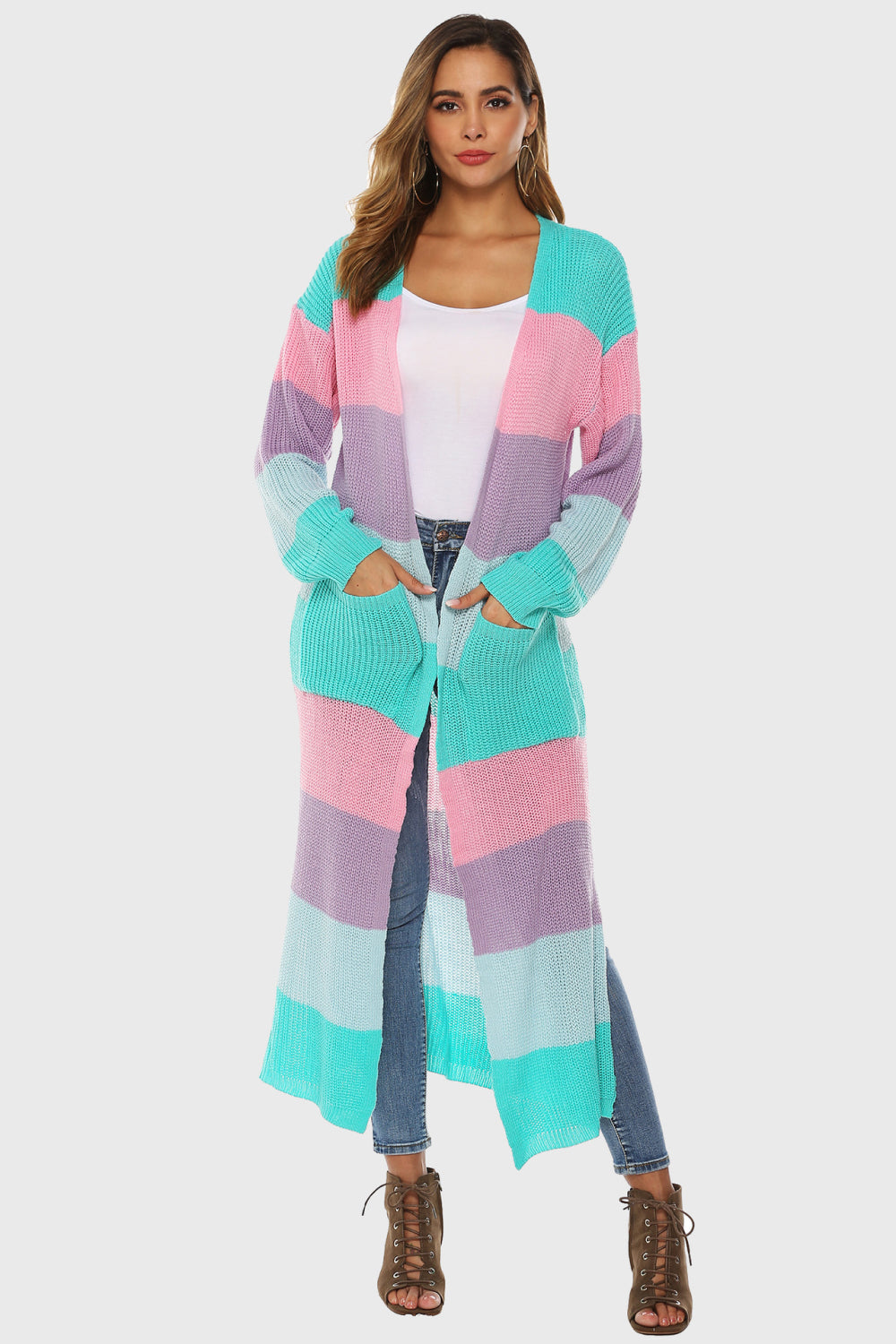 Maxi cardigan with rainbow stripes in aqua, pink, and purple, featuring pockets and a relaxed fit.