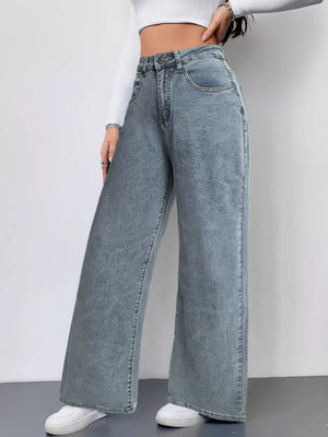 Effortless wide-leg high-waist jeans in washed denim.